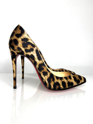 Leopard print high-heeled shoe on a white background