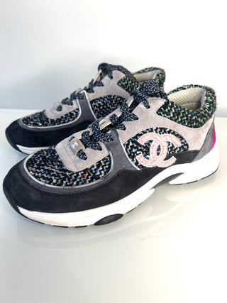 Pair of Chanel sneakers with tweed pattern on a white background