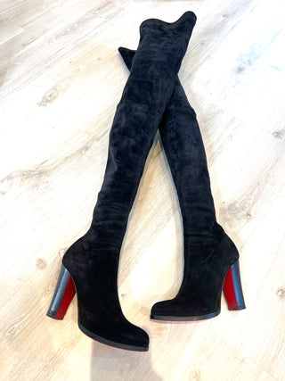 A pair of Christian Louboutin Verusch black suede over-the-knee boots with high block heels and red soles.