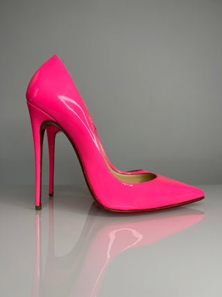 Christian Louboutin So Kate bright pink patent leather stiletto pump with a pointed toe and signature red sole.