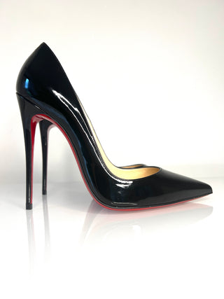 Black high-heeled shoe with red sole on a white background
