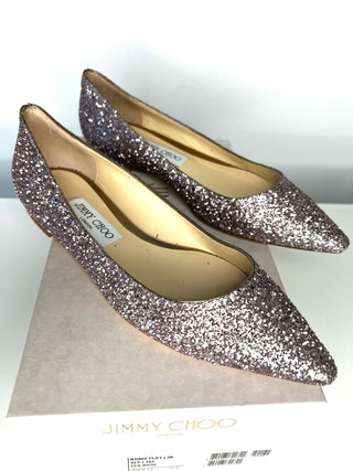 Pair of Jimmy Choo glittery shoes on a white background