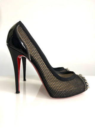 Black high-heeled shoe with mesh design and red sole on a white background