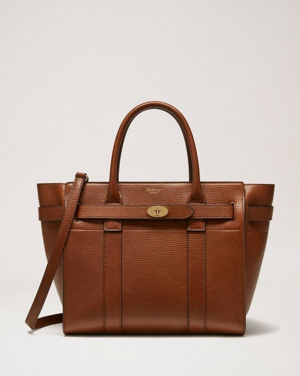 brown grain leather zip hand bag or shoulder bag with signature postman lock
