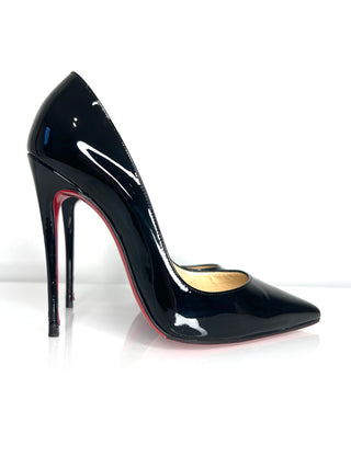 Black high-heeled shoe with red sole on a white background