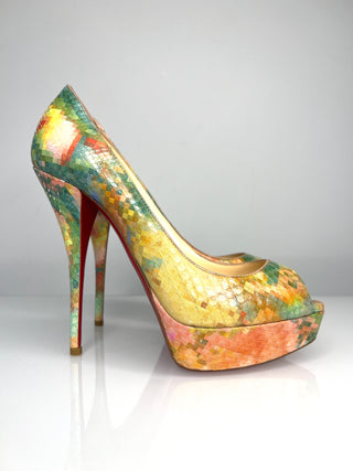Colorful high-heeled shoe with a multicolored platform on a white background