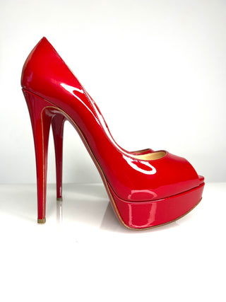 Christian Louboutin Lady Peep high-heeled pump peep-toe shoe in glossy bright red patent leather.