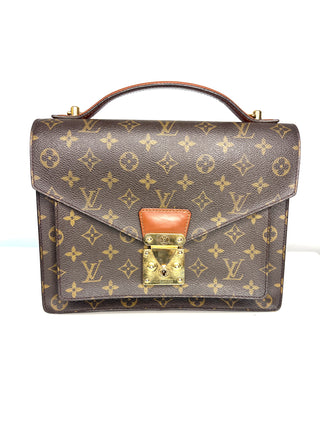 Louis Vuitton vintage Monceau 28 monogram canvas handbag with  top handle, gold-tone hardware, and a flap front featuring the classic LV lock