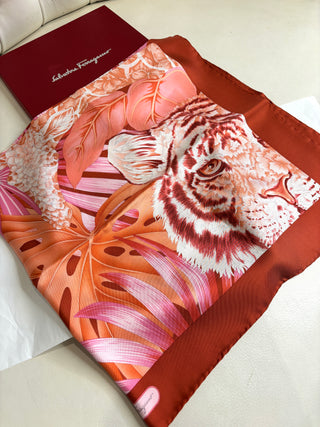 Salvatore Ferragamo scarf with floral design on a white surface