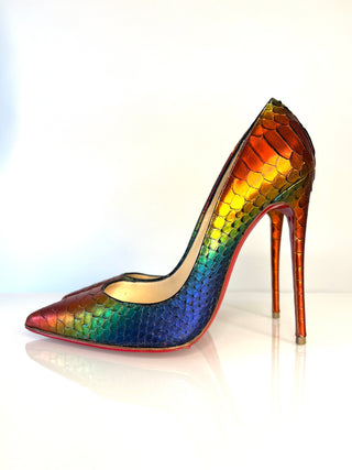 Christian Louboutin So Kate high-heeled pump with a pointed toe, featuring a vibrant iridescent rainbow snakeskin pattern and a slim stiletto heel.