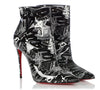 black and white patent printed ankle booties with signature red soles