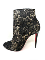 Black lace and leather ankle booties with signature red soles