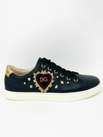 black low top sneakers with signature sacred heart and studs