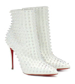 white iridescent spiked ankle bootie with Signature red soles