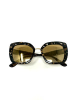 Havana printed on acetone lenses sunglasses with a golden yellow tinted lenses and signature gold hearts on side