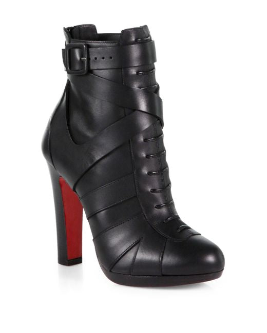 black buckle ankle boots with platforms and red soles