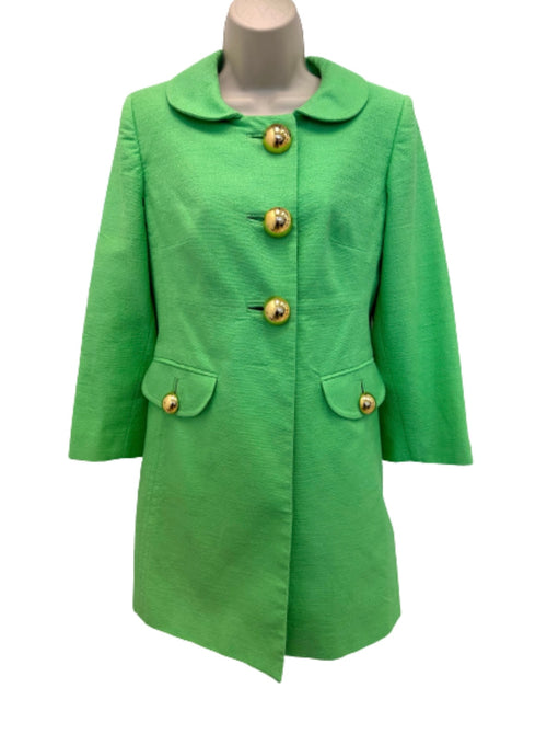 green cotton jacket with silk lining and chunky gold buttons